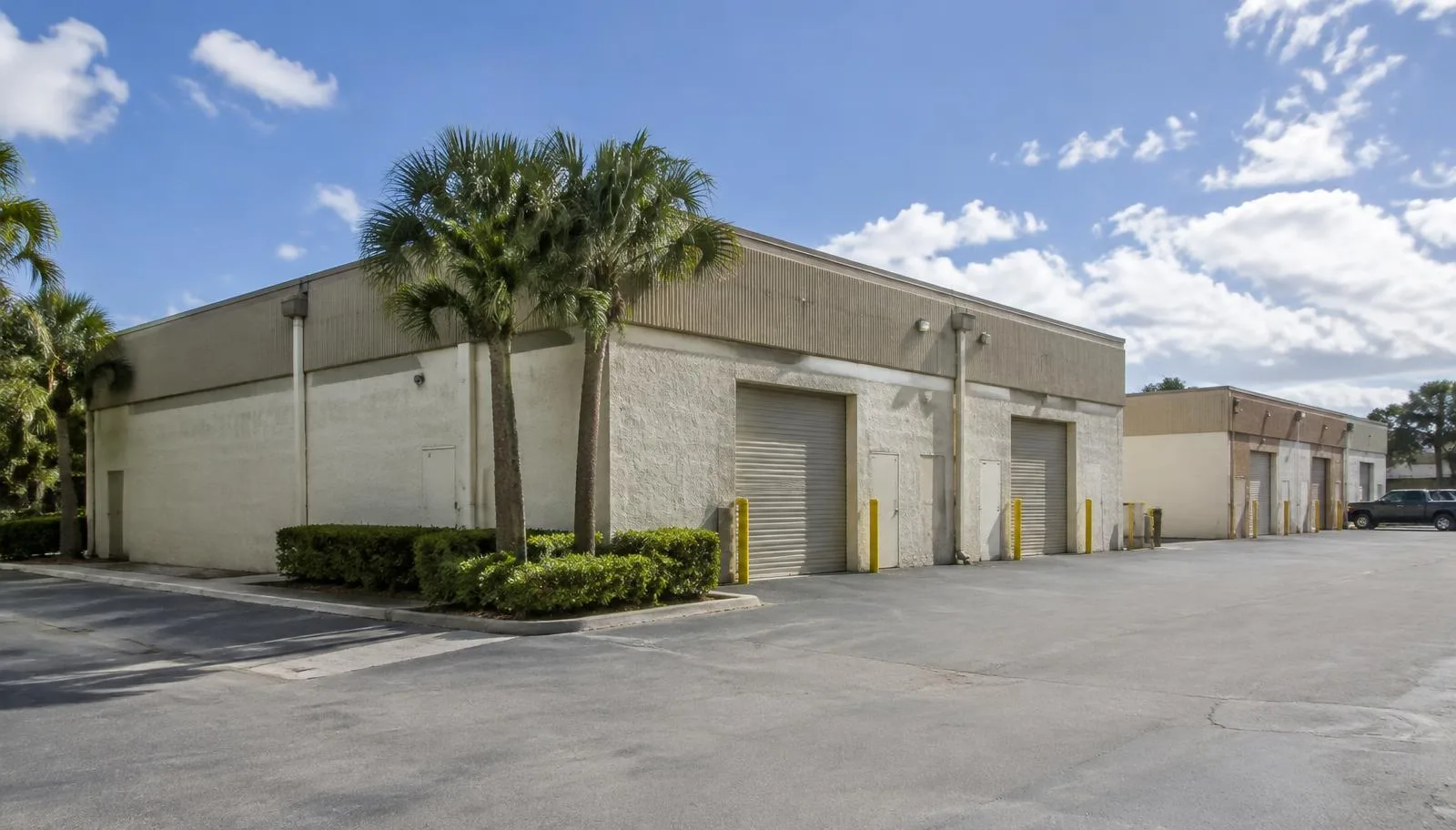 An aging functionally obsolete industrial warehouse in South Florida showing low ceilings and limited loading capabilities.